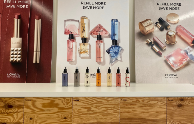 L'Oreal refill station featuring severals perfumes refills bottles at Lagardère Travel Retail HQ